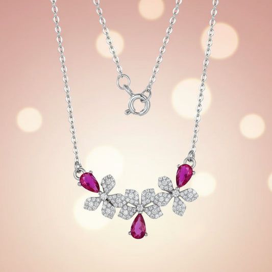 Necklace with pink gemstones and silver floral design