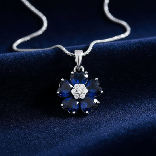 Floral pendant with blue gemstones